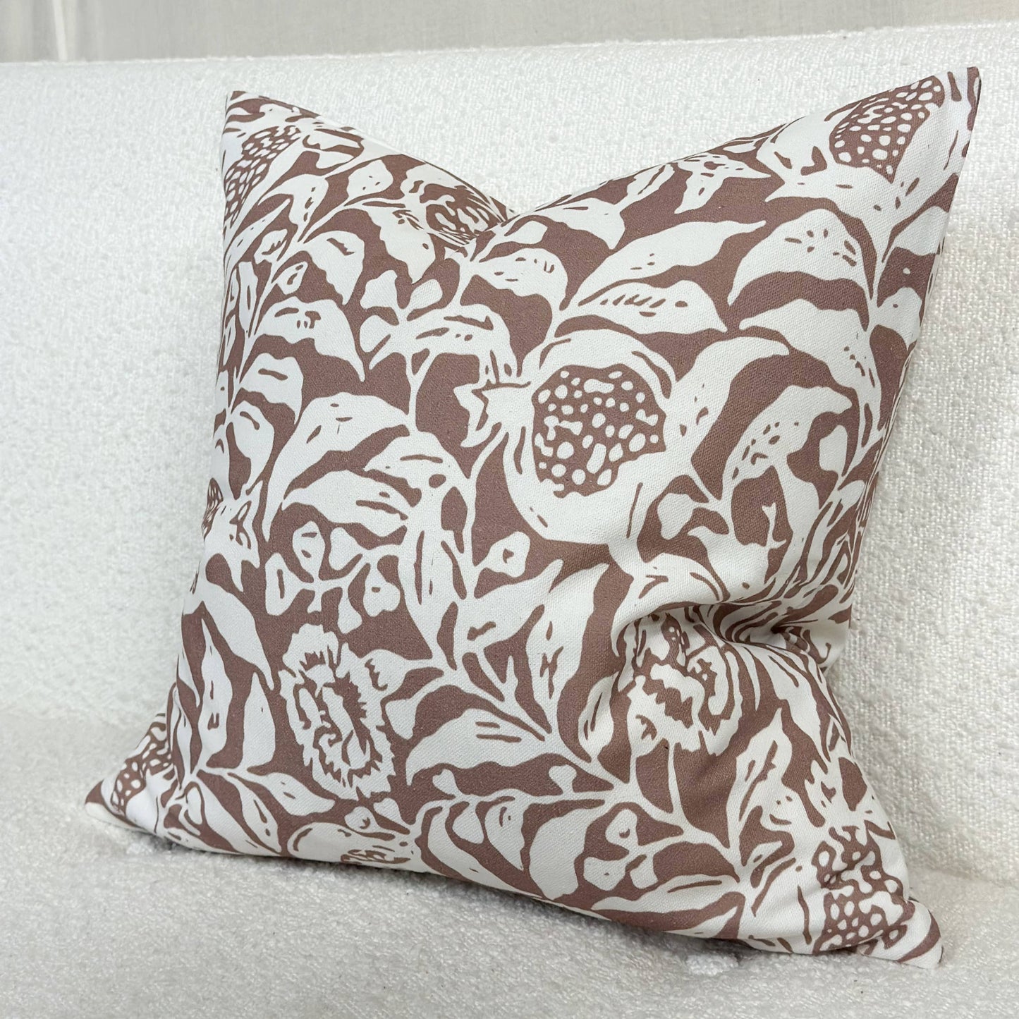 Brown and white floral print cushion