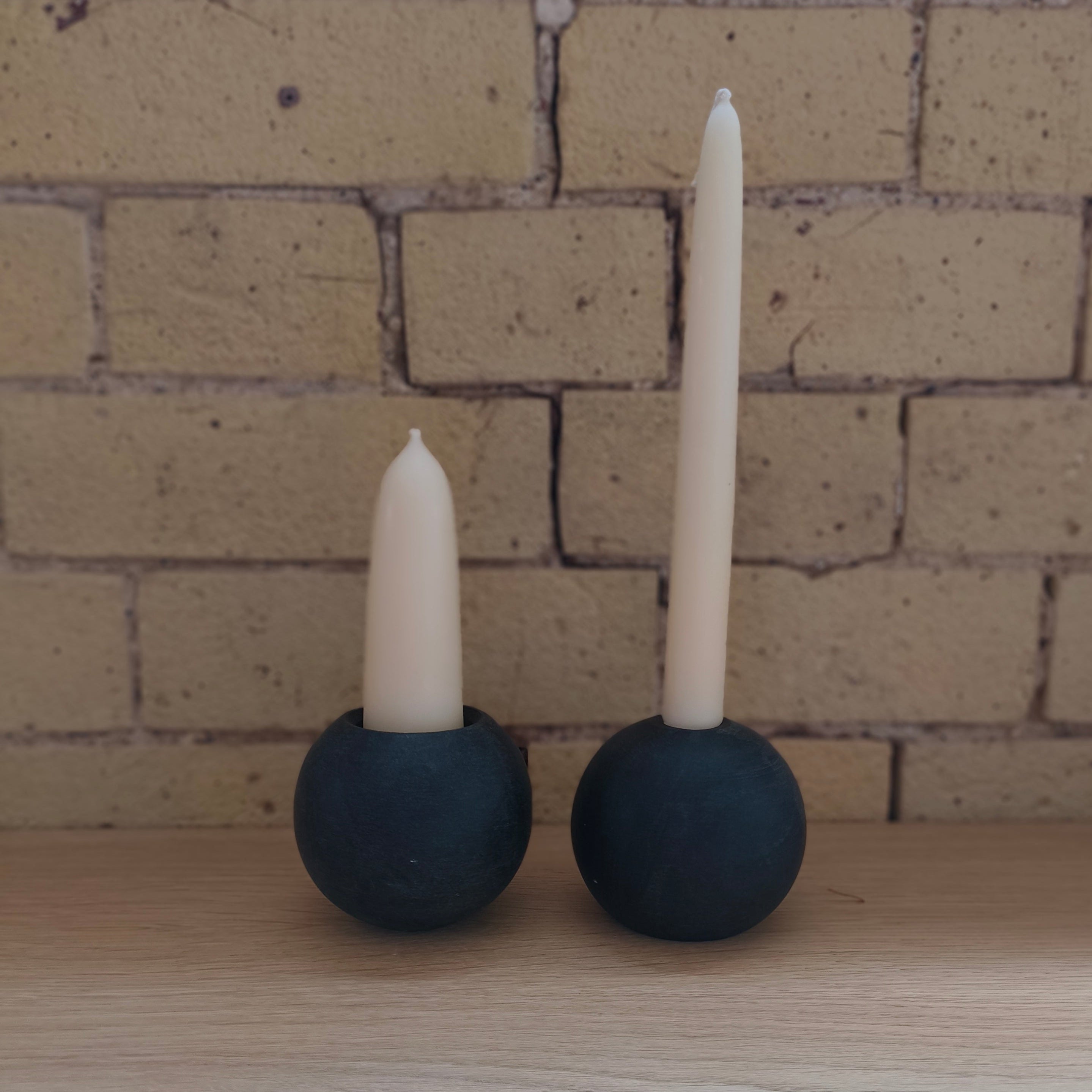 Ball of stone candle holder with candle 
