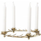 Decorative candle holder with four white candles on a white background