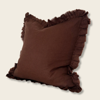 Brown Ruffle edged Cushion on plain background