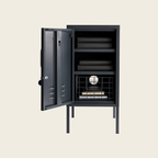 Black metal locker with open door on a beige background
