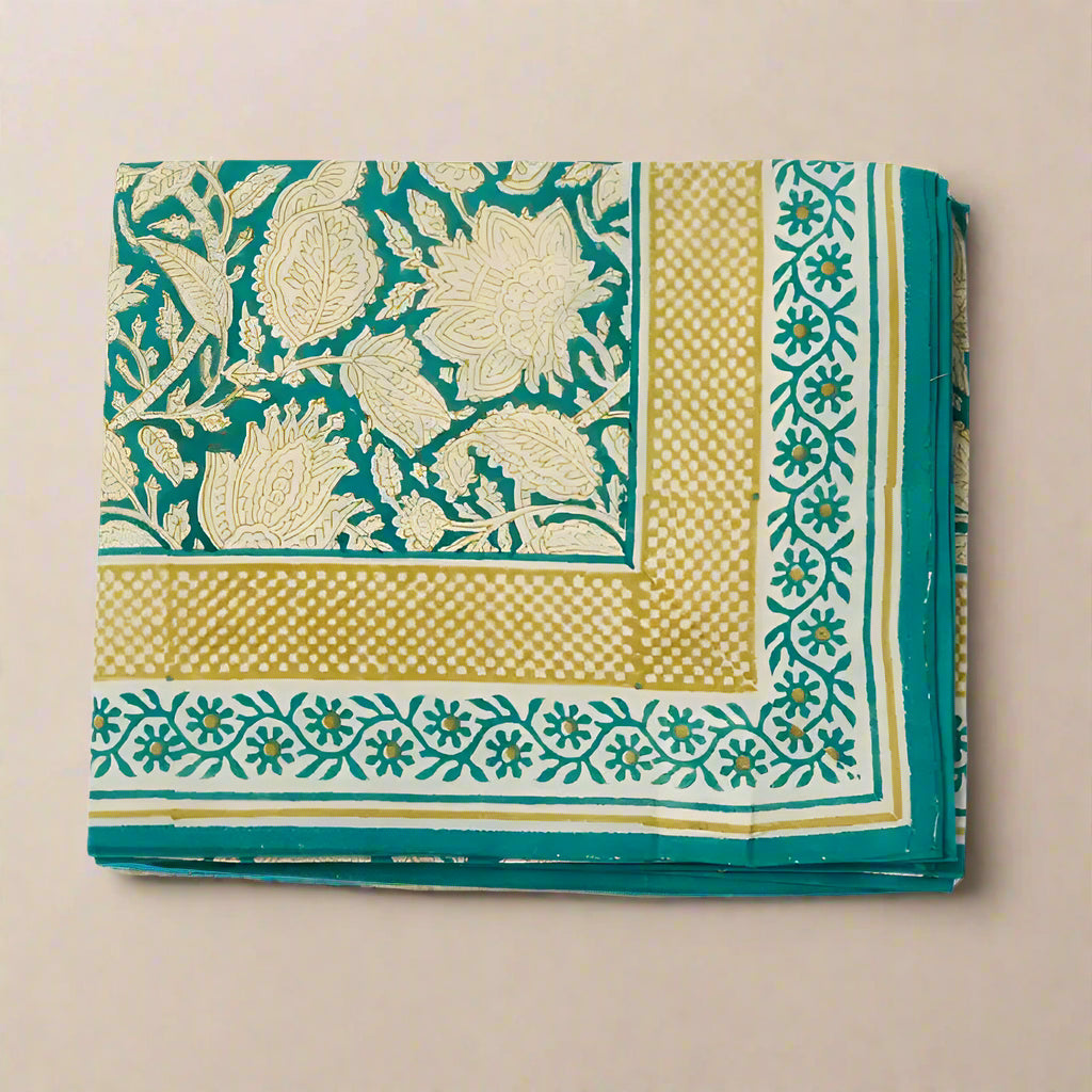 Fabric with green and beige floral patterns on a white background