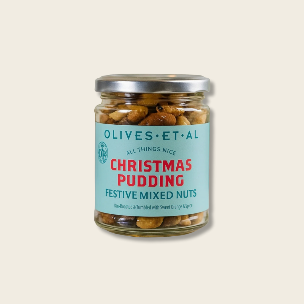 Jar of 'Christmas Pudding' festive mixed nuts with a label on a beige background
