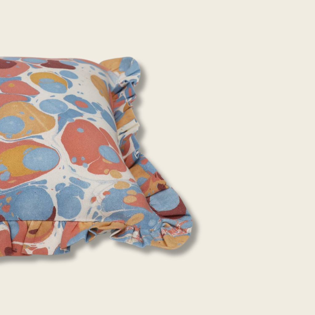 Colorful patterned fabric on a beige background