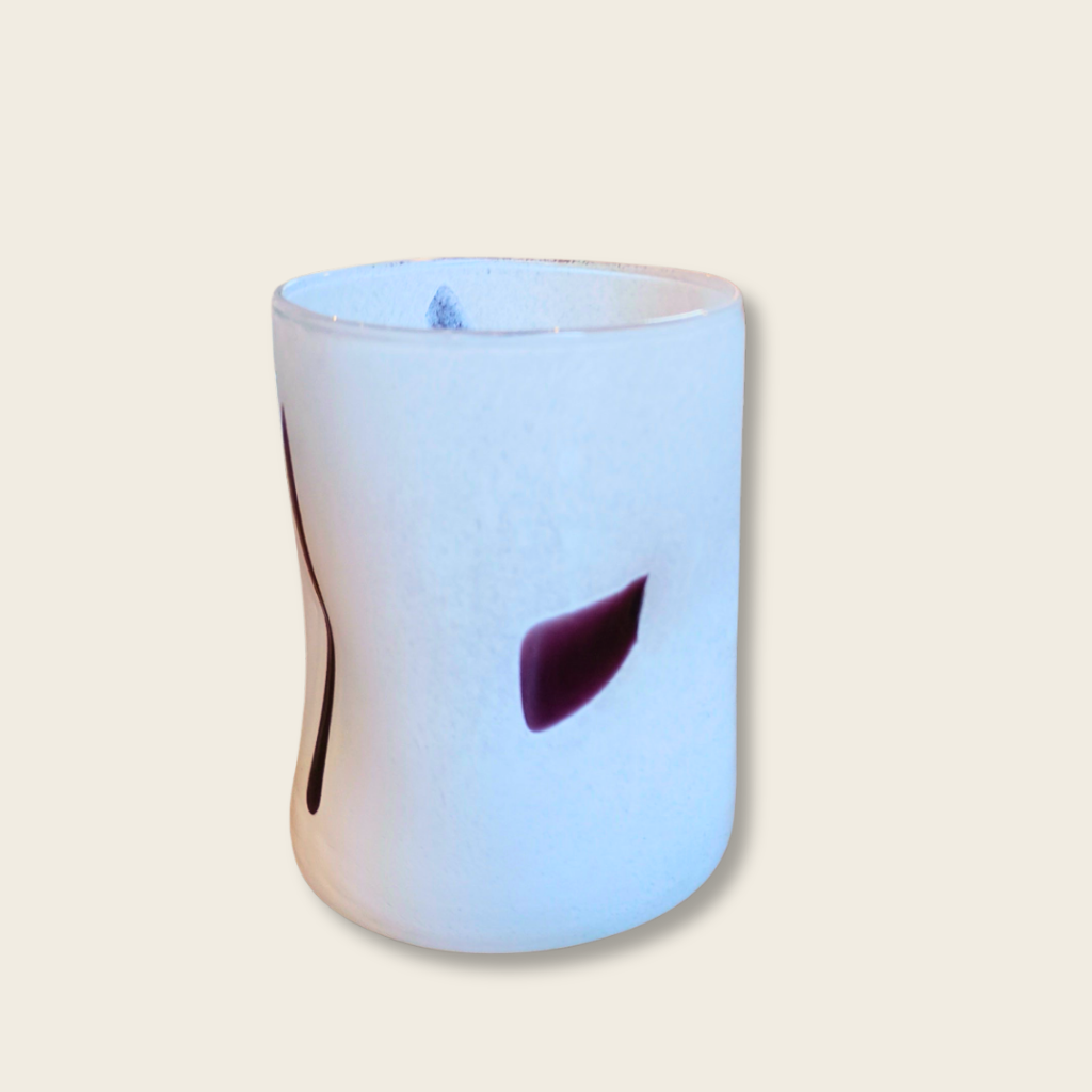 white tumbler with black brush marks