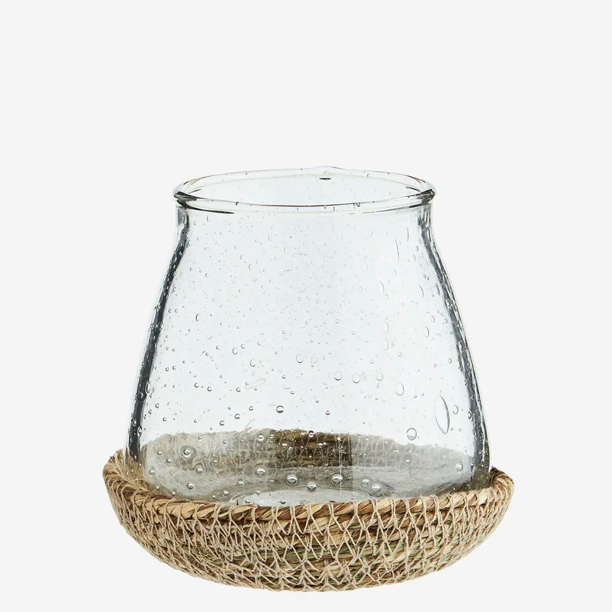 Clear glass lantern with textured base on a white background