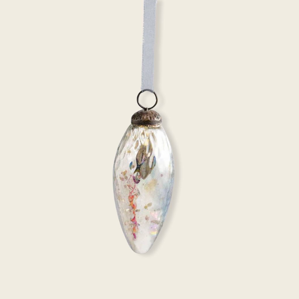 Decorative glass ornament with floral design on a white background