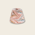 hand marbled pink pleated lamp shade on beige background