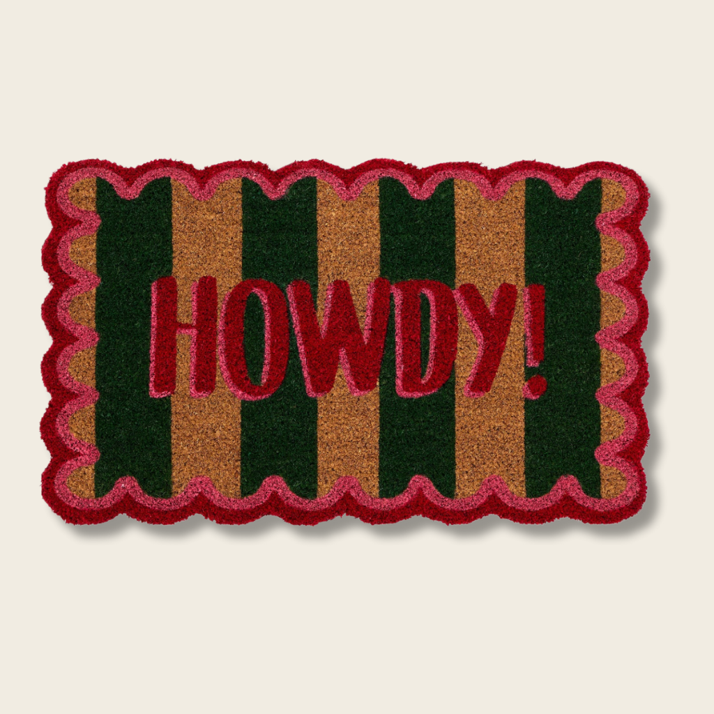 Doormat with 'HOWDY!' text on a striped background