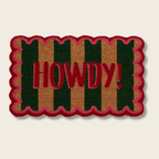 Doormat with 'HOWDY!' text on a striped background