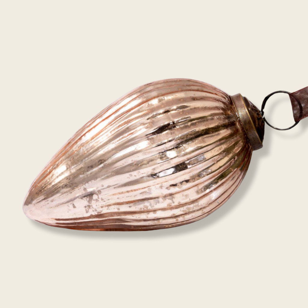 Decorative glass item with ribbed texture on a beige background