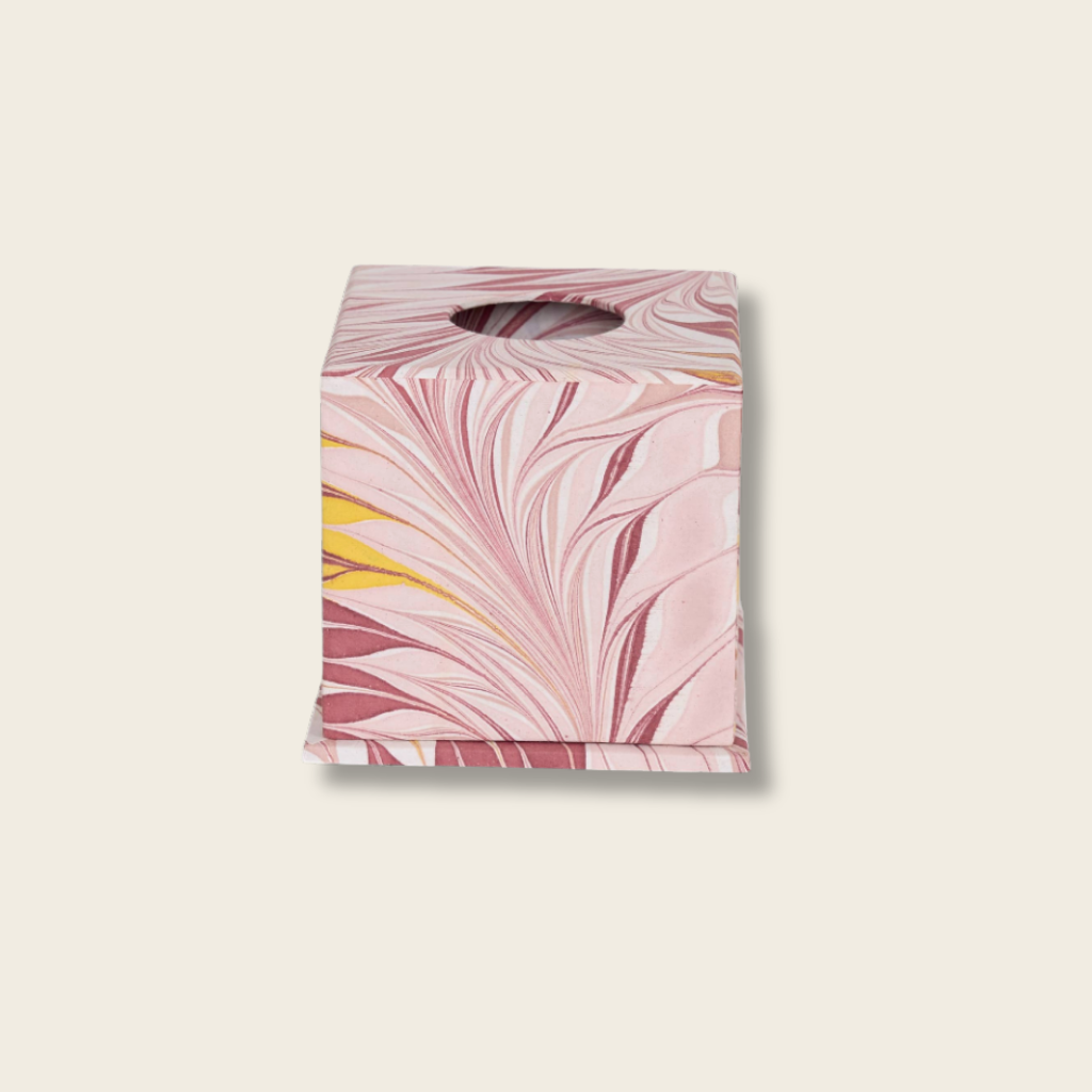 Marble-patterned tissue box cover on a beige background