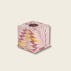 tissue box cover with pink and yellow leaf pattern on a beige background