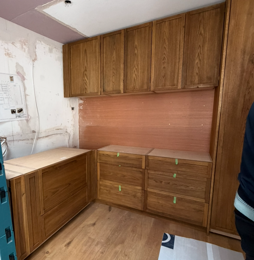 custom kitchen, wood, being installed