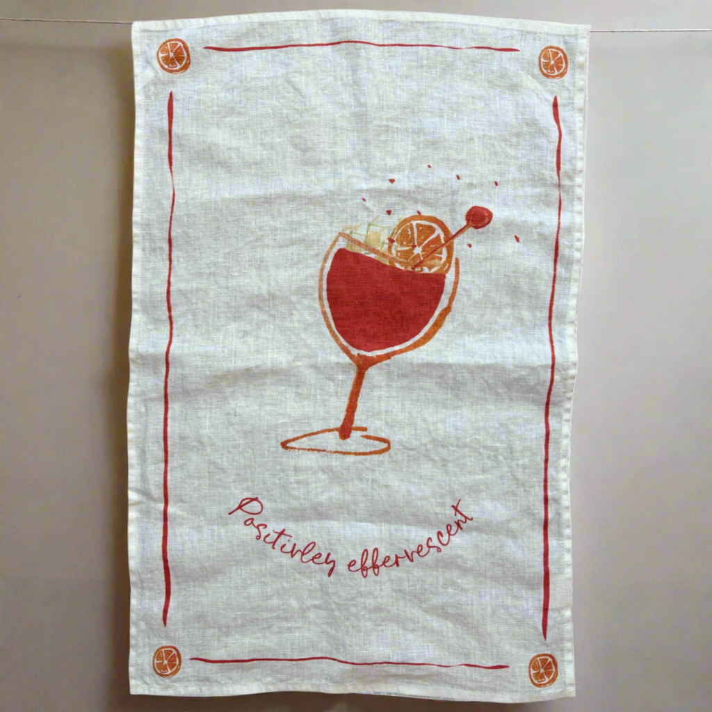Linen tea towel with Aperol positively effervescent print