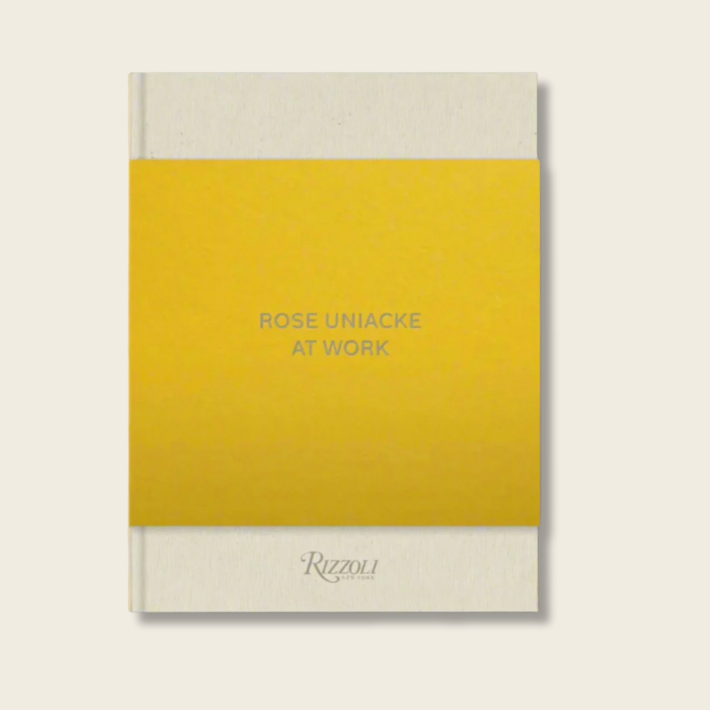 Book cover with yellow and beige color scheme featuring text 'Rose Uniacke at Work' and 'Rizzoli'.