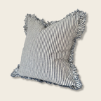 Ruffled Linen Cushion with a Navy pinstripe on a beige background