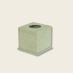 Green textured tissue box on a beige background