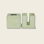 Green patterned tissue box cover and holder on a beige background