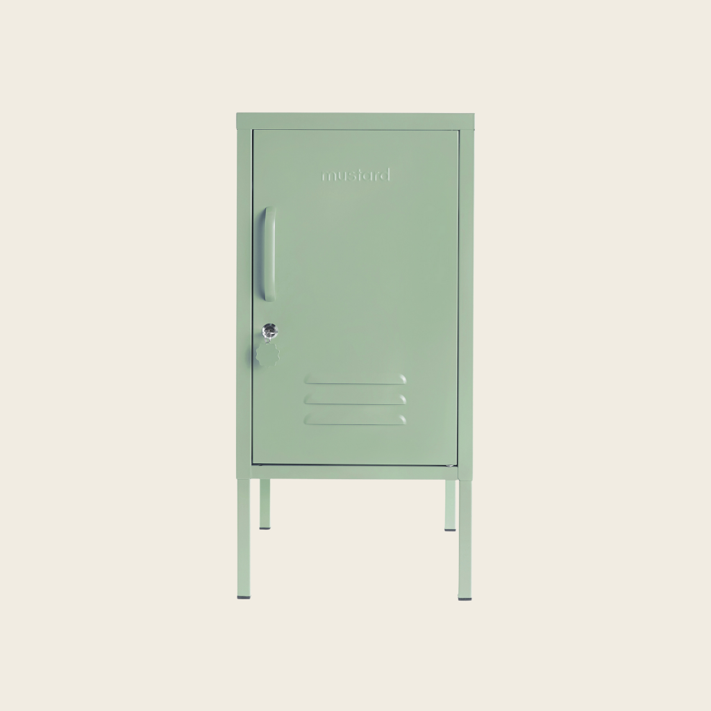Sage metal locker on a beige background
