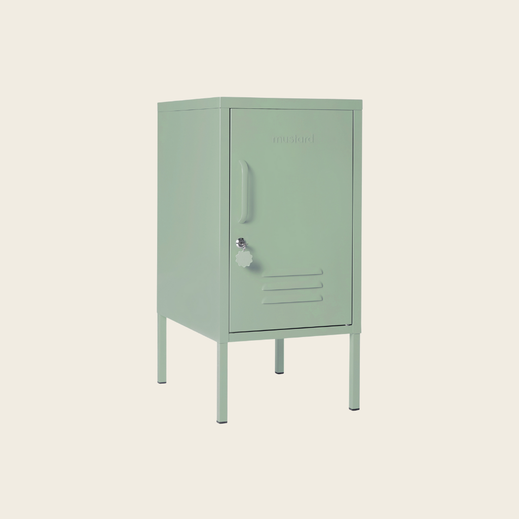 Sage metal locker on a beige background