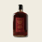Bottle of Selsley Gourmet Mulling Syrup on a beige background