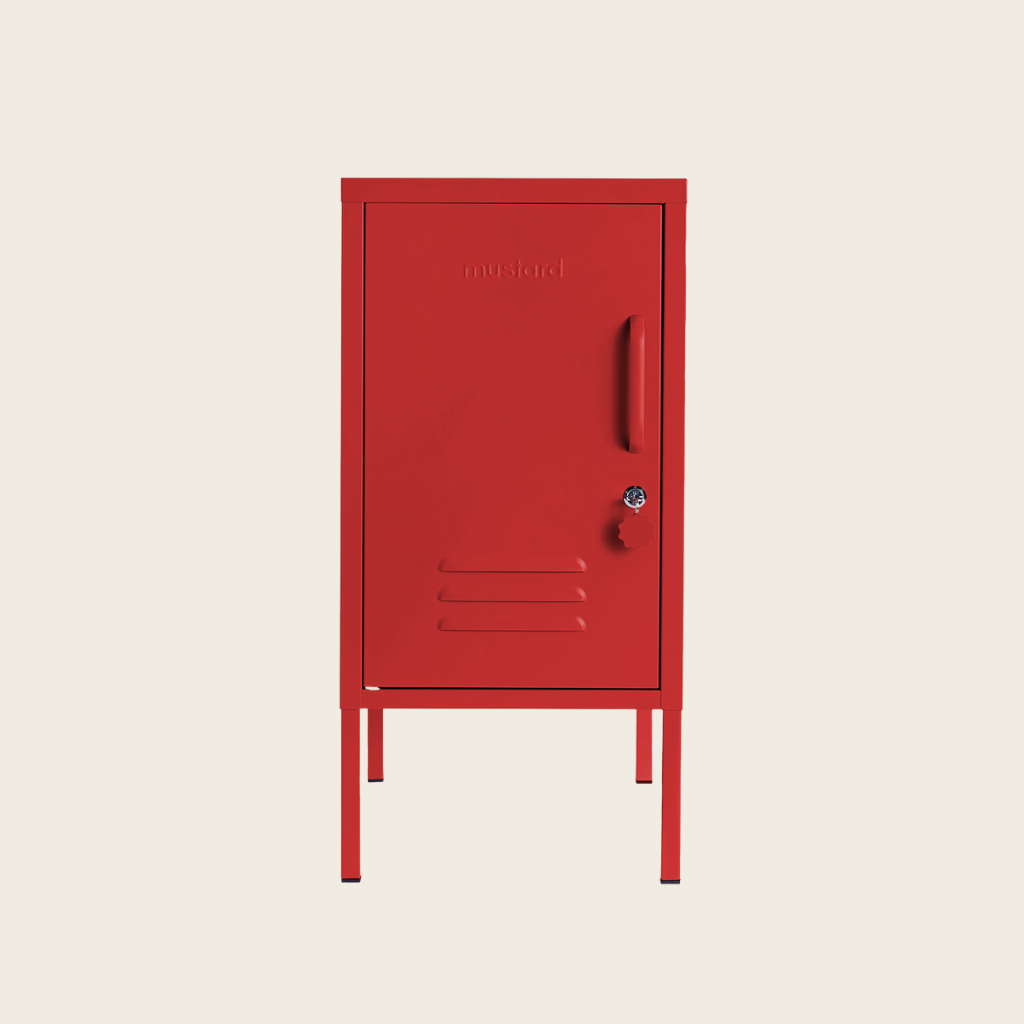 Red metal locker on a beige background