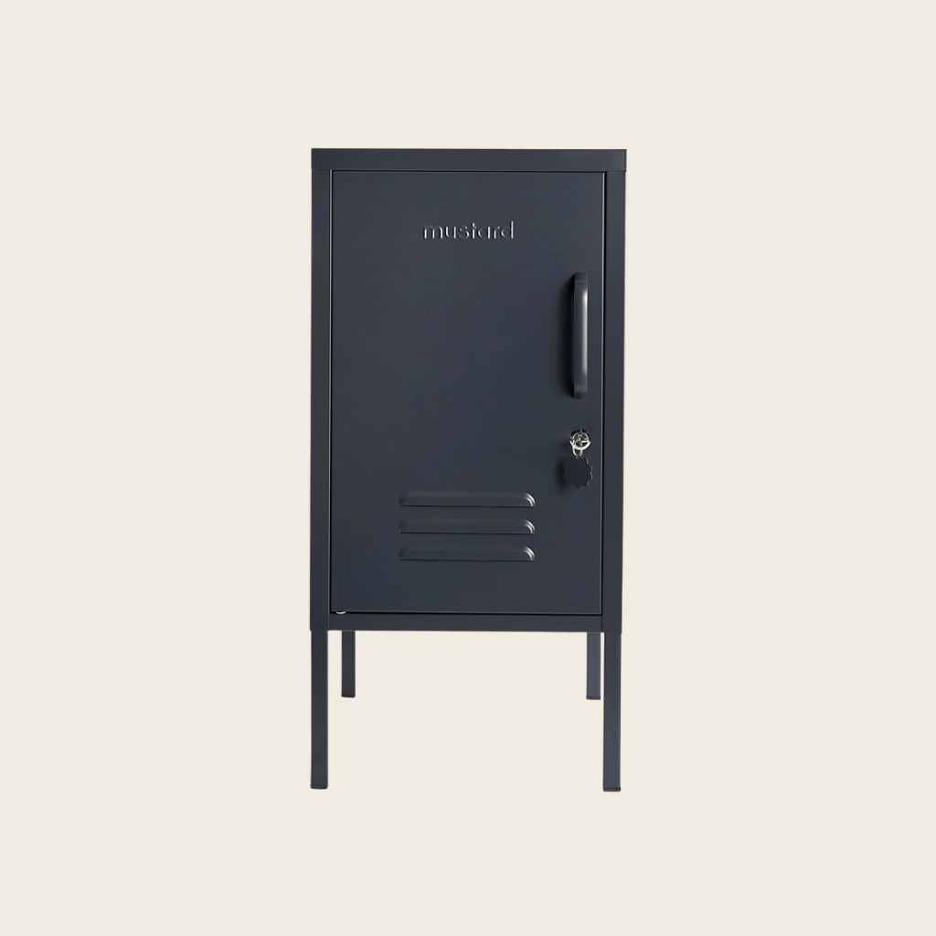 Black metal locker with 'Mustard' branding on a beige background