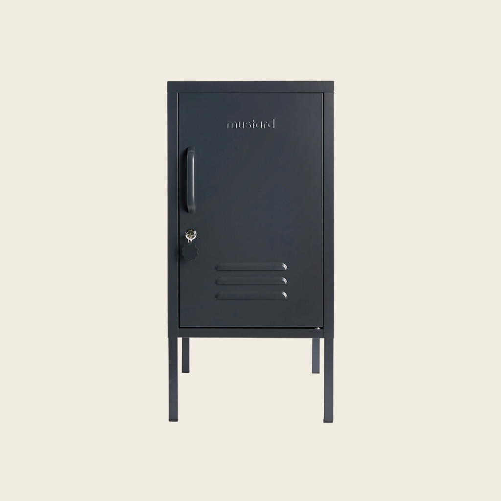 Black metal locker with 'outward' branding on a beige background