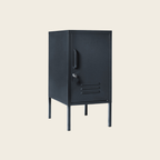 Slate metal locker with a handle on a beige background