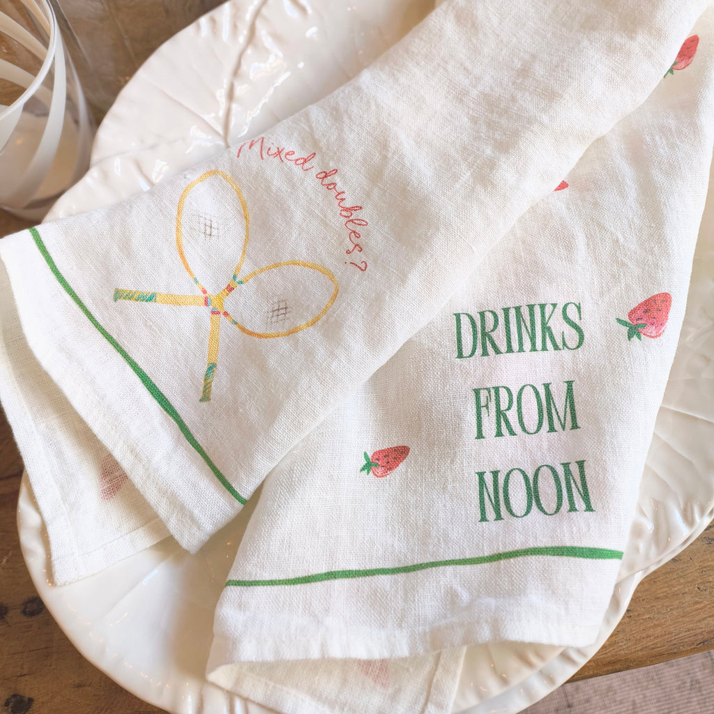 Set of printed napkins with text and graphics on a wooden surface