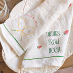 Set of printed napkins with text and graphics on a wooden surface