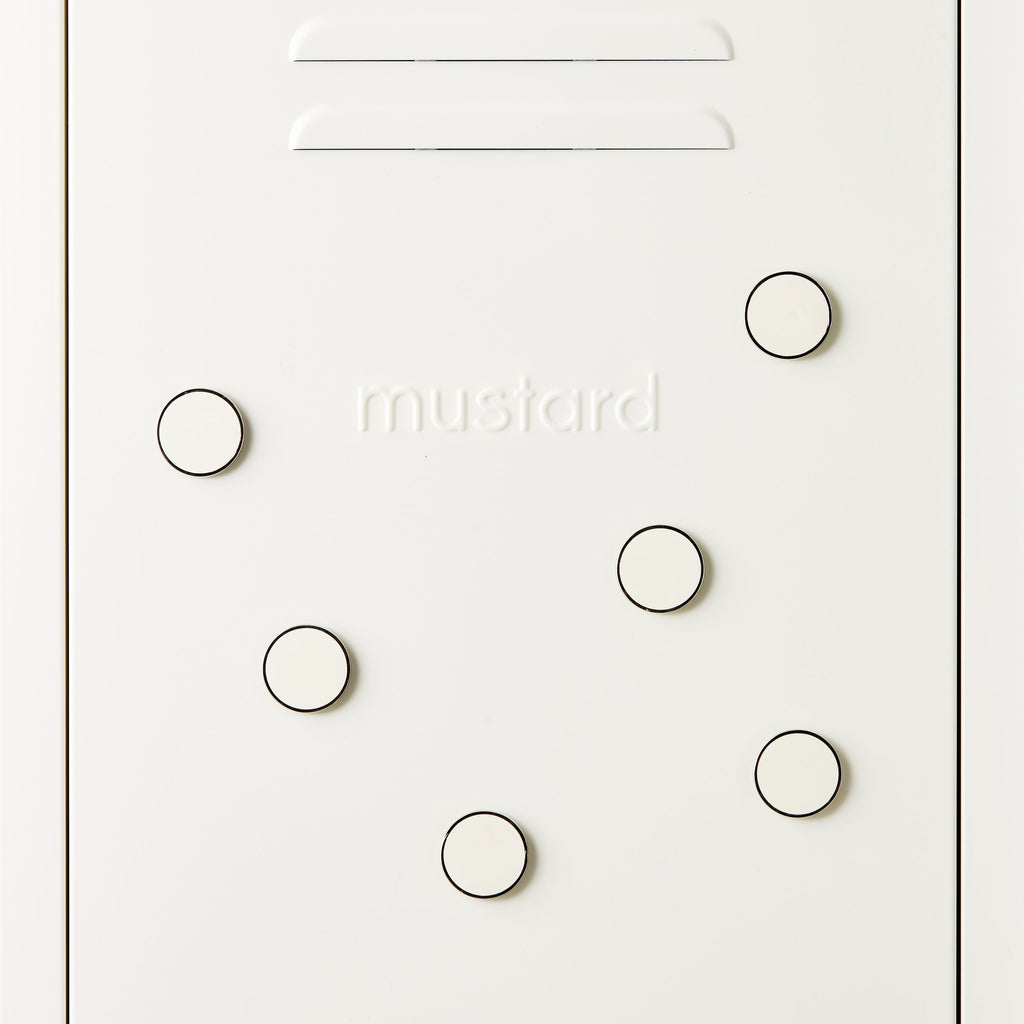 White door with circular magnets and 'mustard' branding
