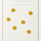 Mustard yellow circular magnets on a white background with 'mustard' text.