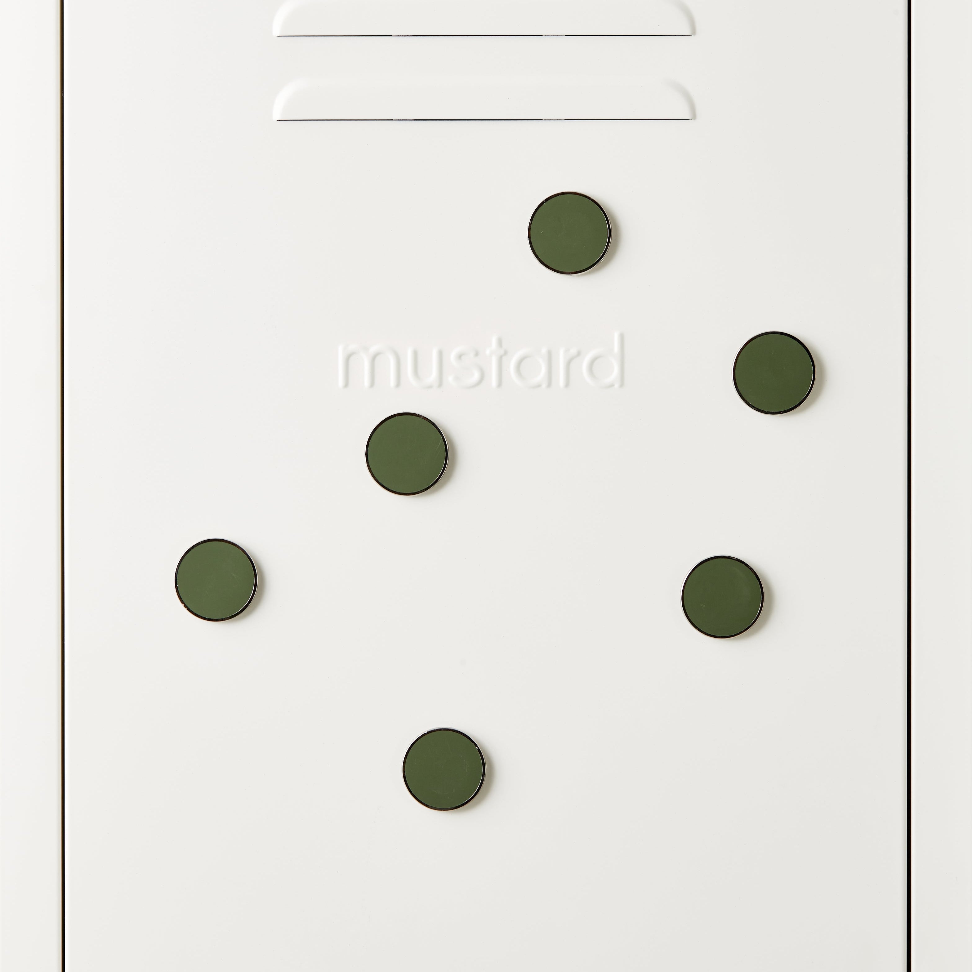 White door with green circular magnets and 'mustard' text