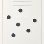 White door with black circular magnets and 'mustard' branding.