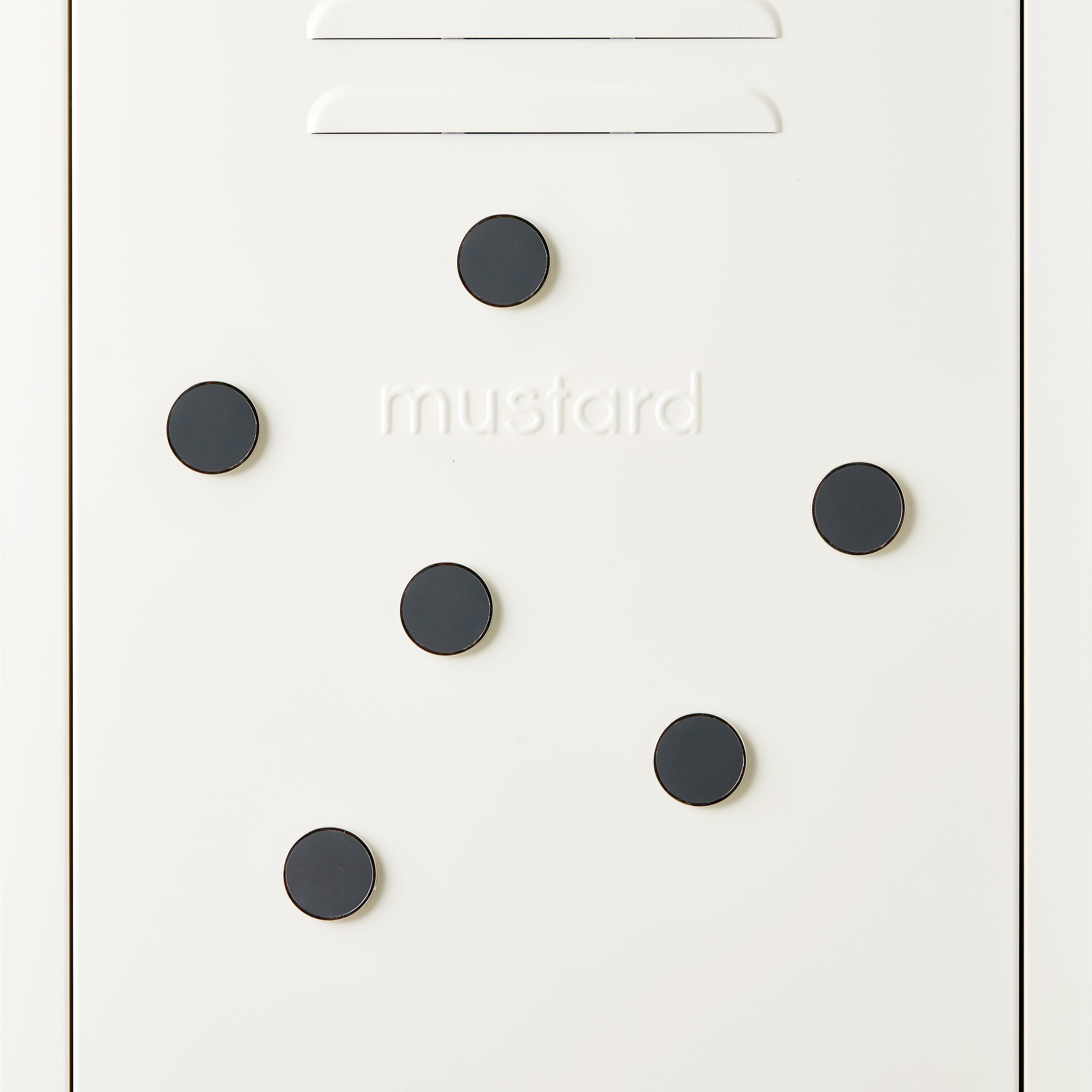 White door with black circular magnets and 'mustard' branding.