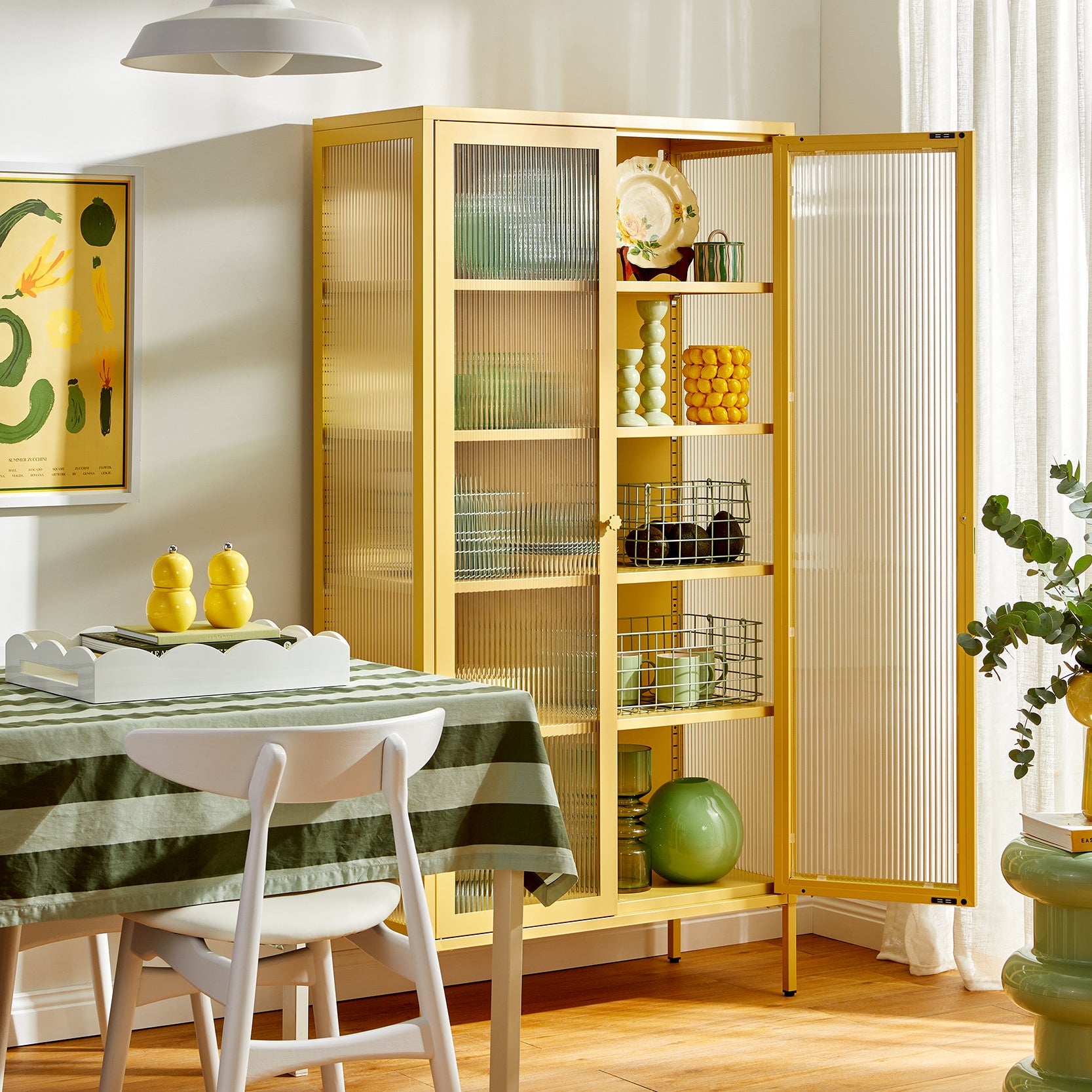 Dining room with a yellow cabinet, table, and chairs.