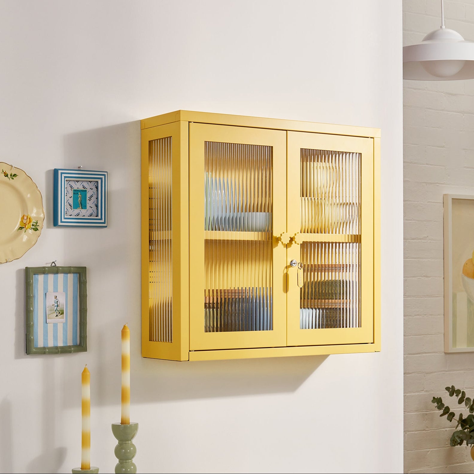 Yellow wall cabinet with glass doors in a room setting