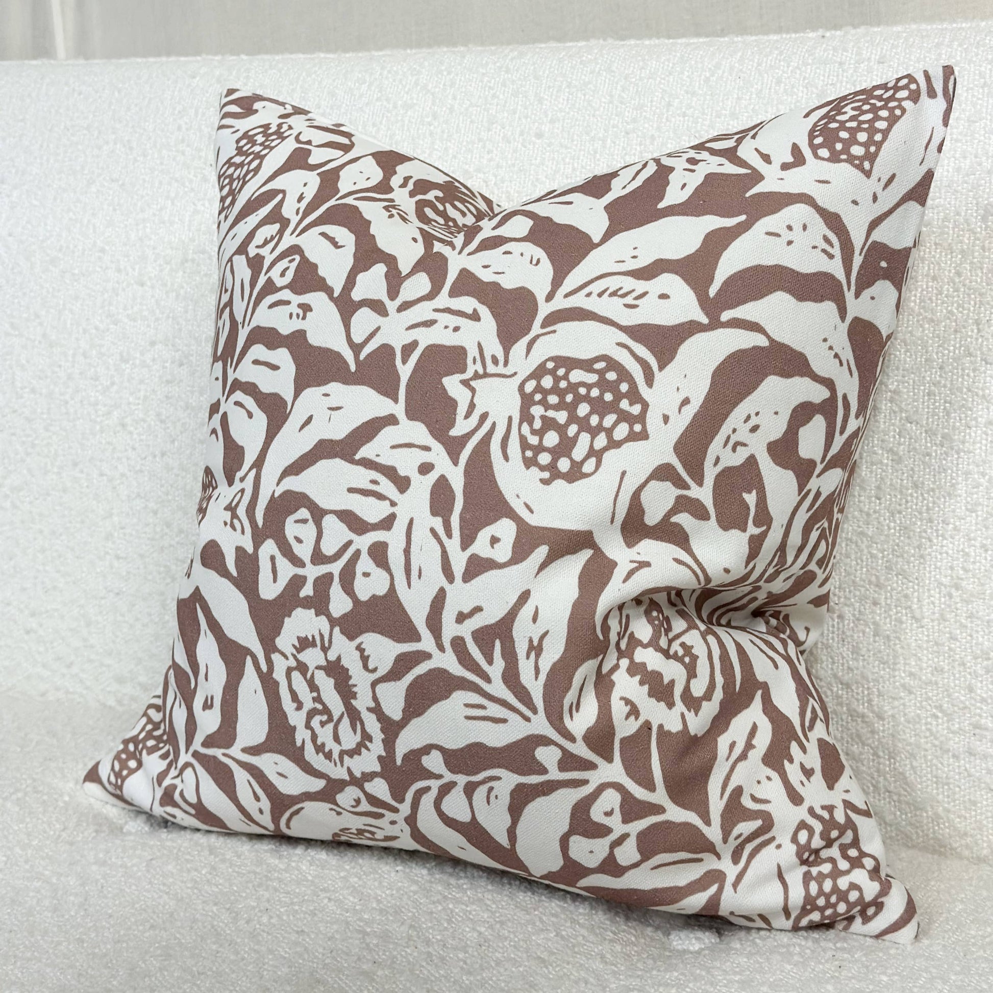 Brown and white floral print cushion