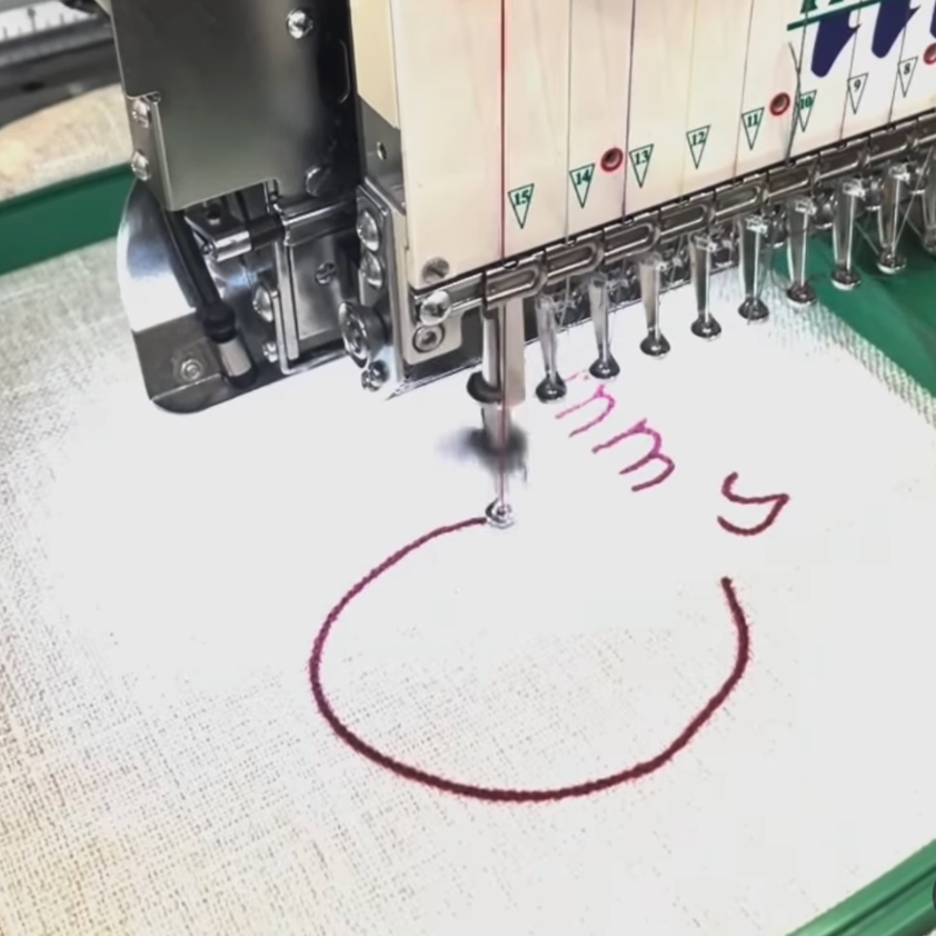 Embroidery machine stitching on cushion