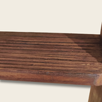 Close-up of a wooden surface with a visible grain pattern on a white background