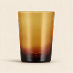 Almond shell hand blown recycled glass tumbler on a cream background