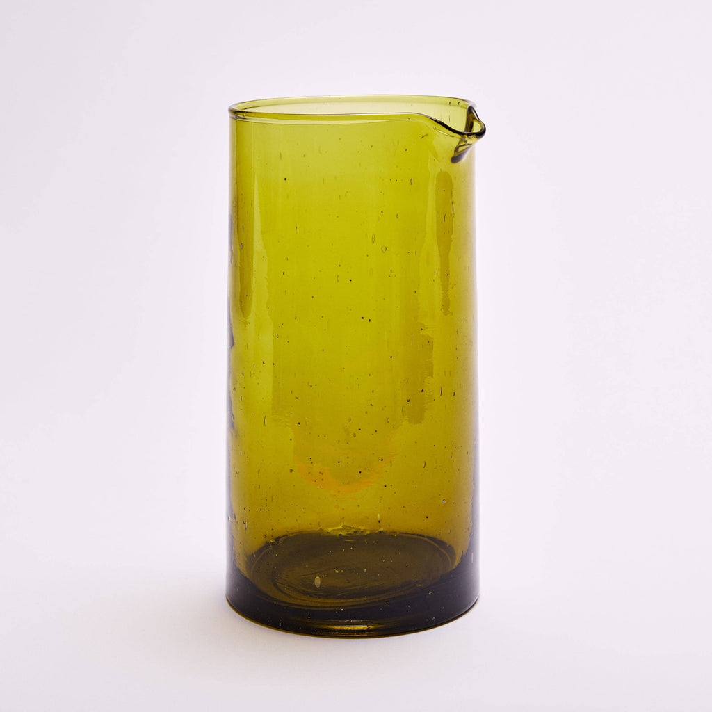 Amber recycled glass carafe holding water
