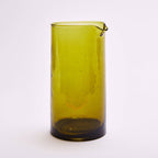 Amber recycled glass carafe holding water