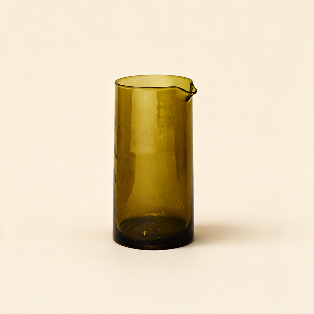 Amber recycled glass carafe on a cream background