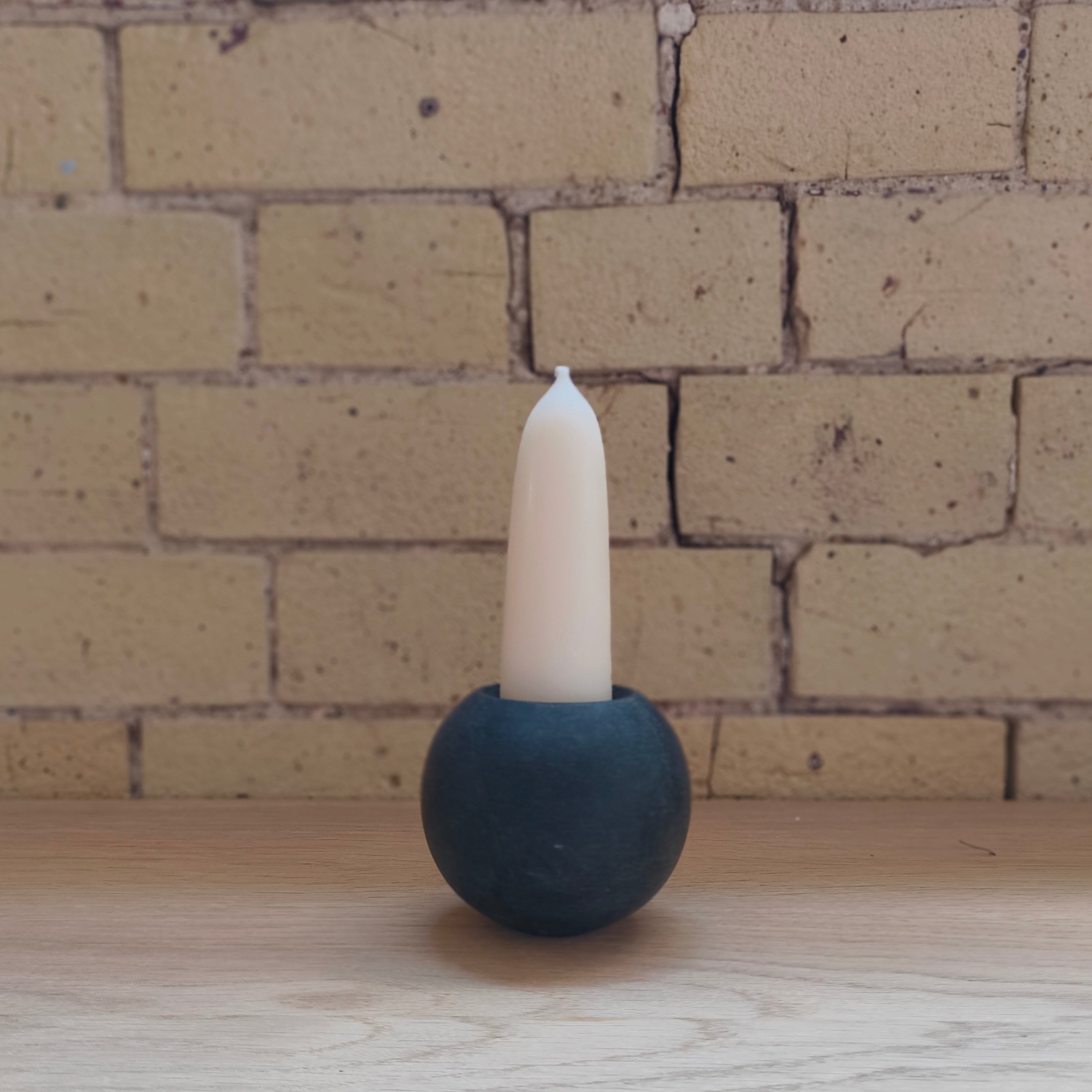 ball of stone candle holder