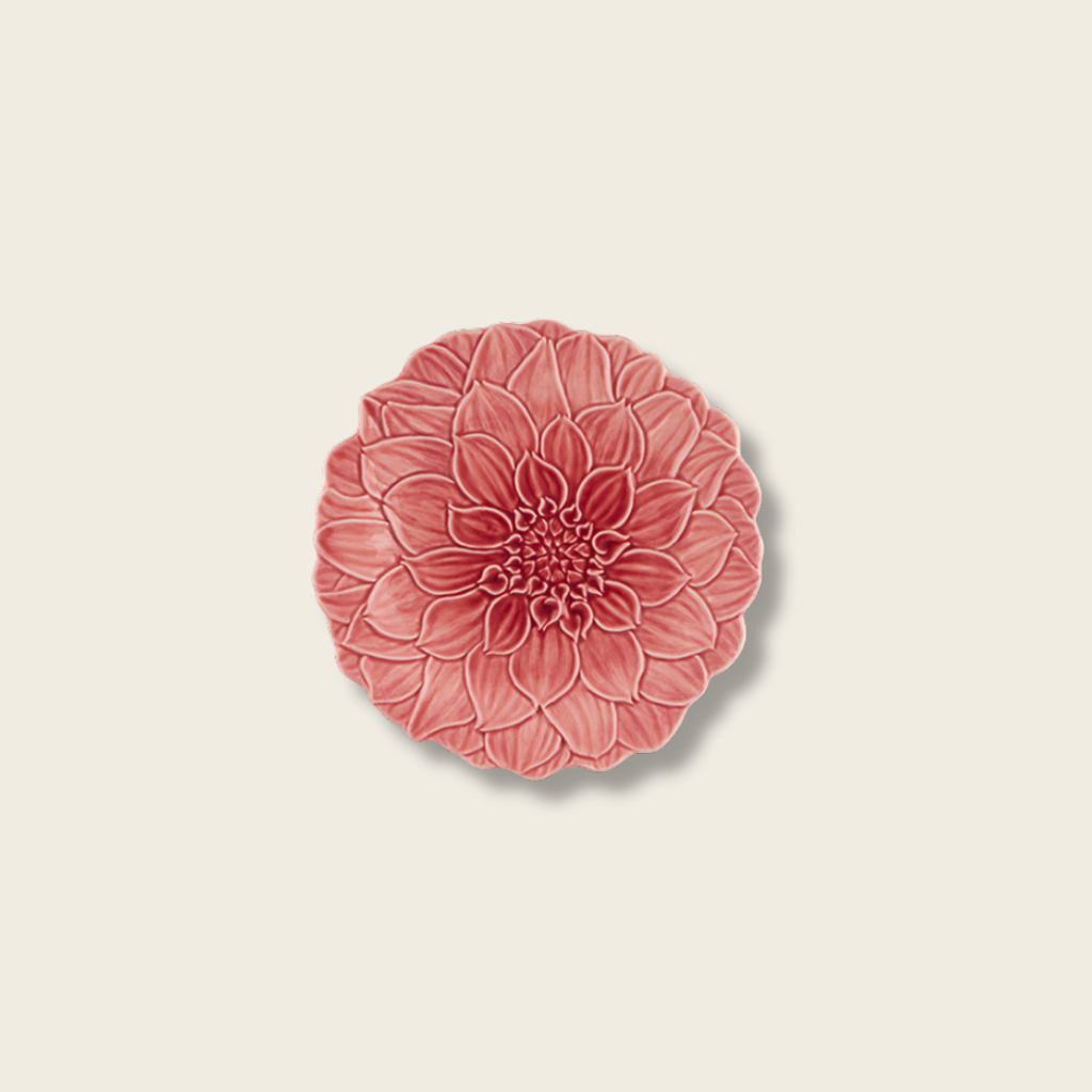 Decorative pink floral wall plate on a beige background