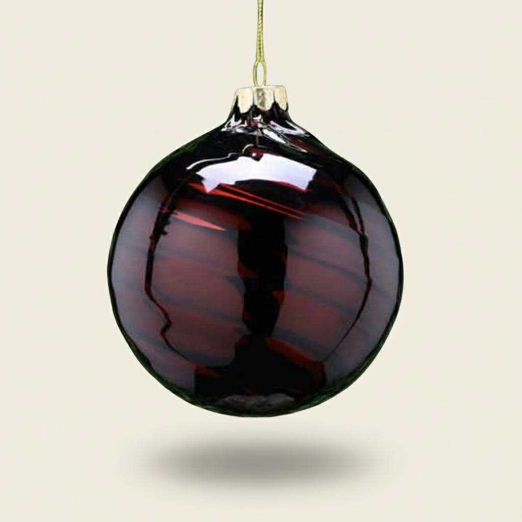 Brown glass Christmas ornament on a beige background