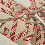 Close-up of a fabric with candy cane pattern on a beige background
